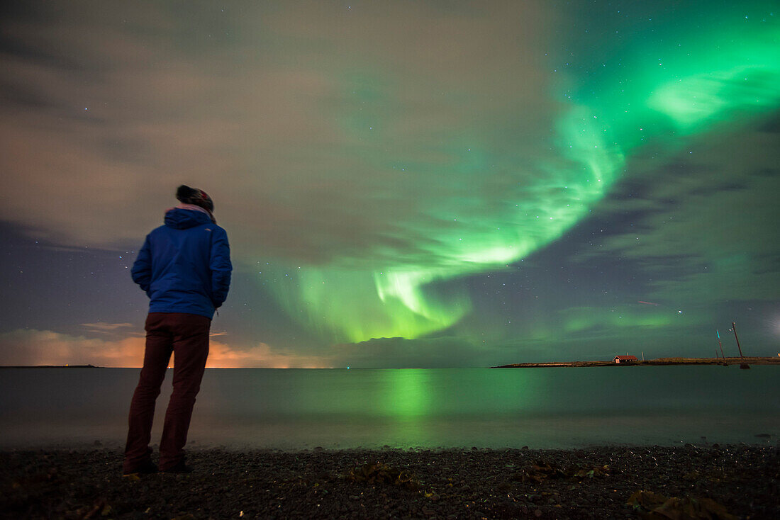 Tourist watching the Northern Lights Aurora Borealis, Reykjavik, Iceland, Polar Regions