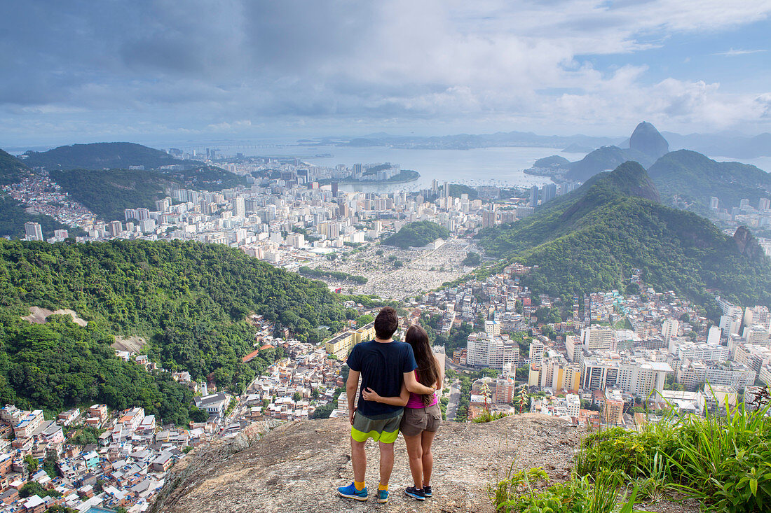 Hikers looking out over Rio de Janeiro from the Morro dos Cabritos hill, Rio de Janeiro, Brazil, South America