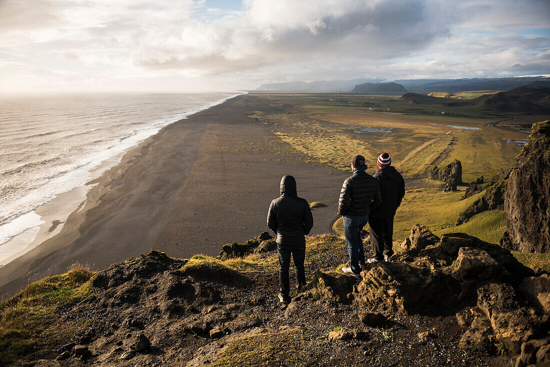 Tourists looking at the view at sunset from Dyrholaey Peninsula, near Vik, South Iceland Sudurland, Iceland, Polar Regions