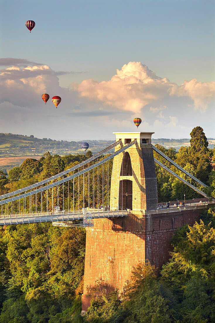 Clifton Suspension Bridge, with hot air balloons in the Bristol Balloon Fiesta in August, Clifton, Bristol, England, United Kingdom, Europe