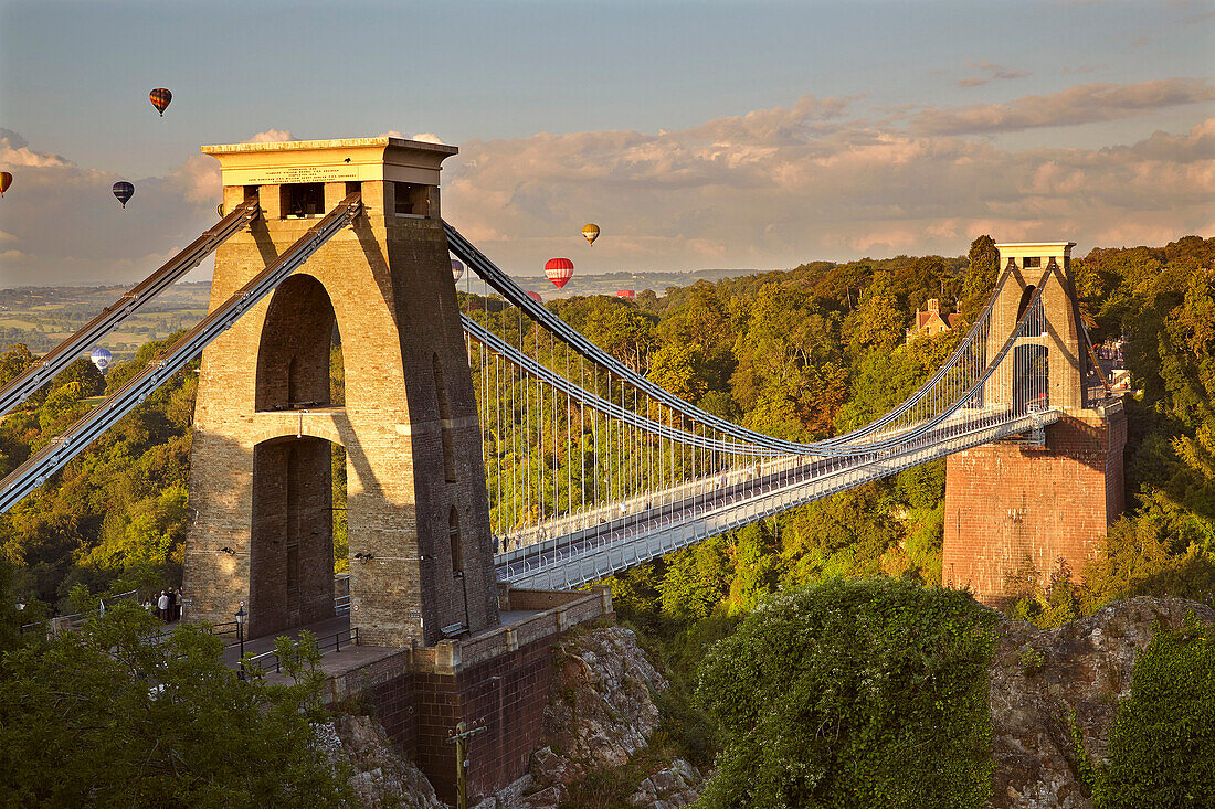 Clifton Suspension Bridge, with hot air balloons in the Bristol Balloon Fiesta in August, Clifton, Bristol, England, United Kingdom, Europe
