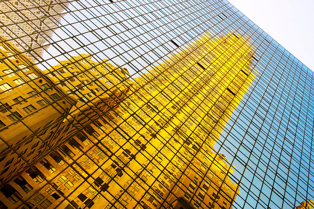The Chrysler Building reflected in modern glass skyscraper, Lexington Avenue, New York, United States of America, North America