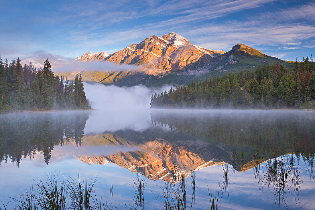 Pyramid Mountain reflected in Pyramid Lake at dawn on a misty morning, Jasper National Park, UNESCO World Heritage Site, Alberta, Canada, North America