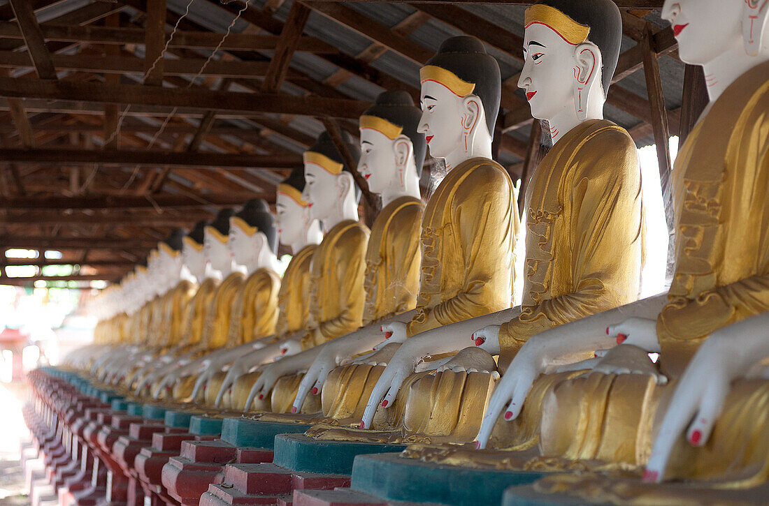 Line of seated Buddhas at the Maha Bodhi Ta Htaung monastery, Monywa township, Sagaing Division, Myanmar Burma, Asia