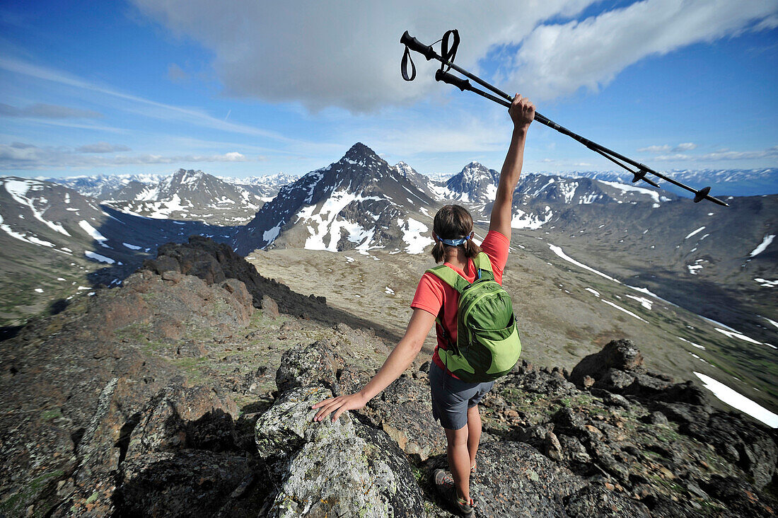 Hikers on the ridge that connects Flattop Mountain, Peak 2, Peak 3, and Flaketop to Ptarmigan Pass in Chugach State Park near Anchorage, Alaska June 2011. The four-mile traverse is a popular local hike and suitable for trail running.