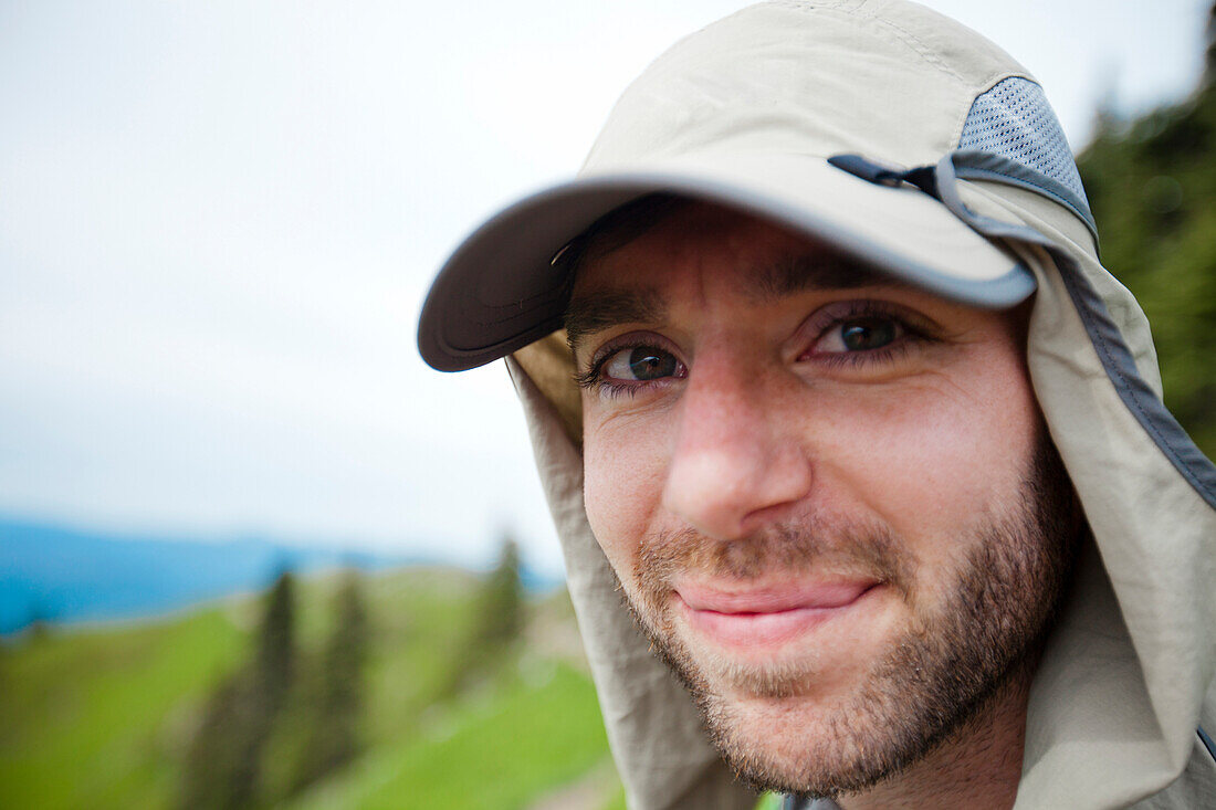 Portrait of a hiker wearing a bug net hat to protect from insect bites.