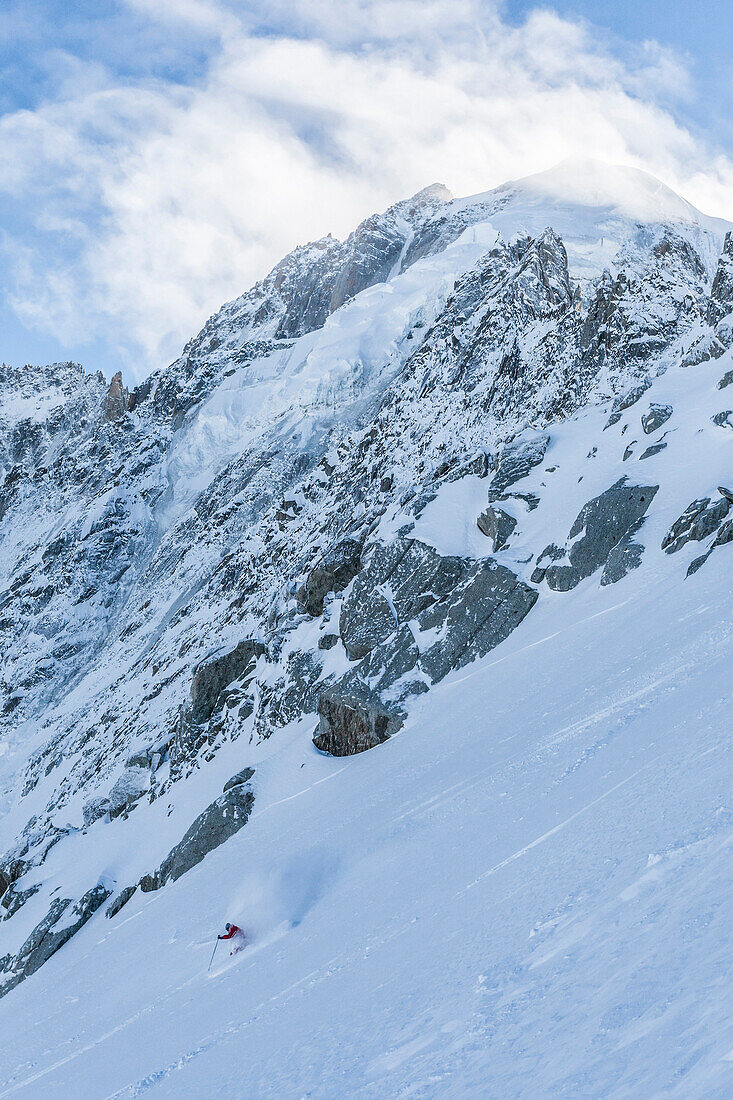 Skier hitting the powder with the Petite Verte in the background