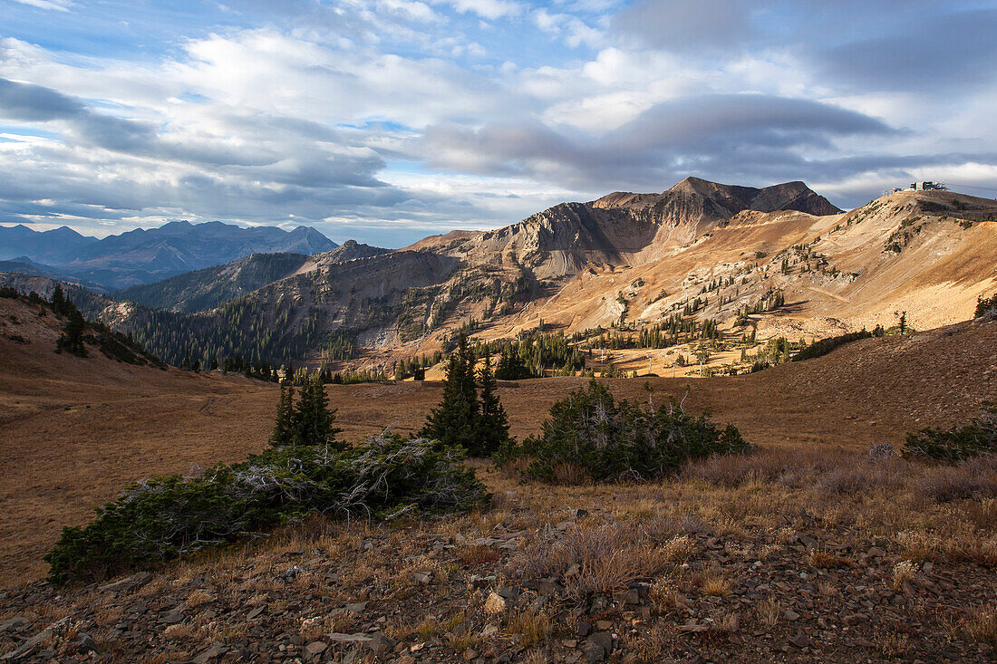 Mineral Basin at Snowbird Resort is bathed in early morning light on a crisp fall day in the Wasatch Mountains.