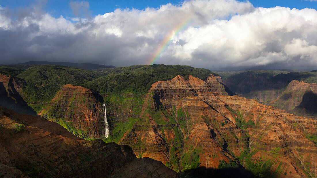 Waterfall and a rainbow, looking out across Wiamea Canyon, Kauai