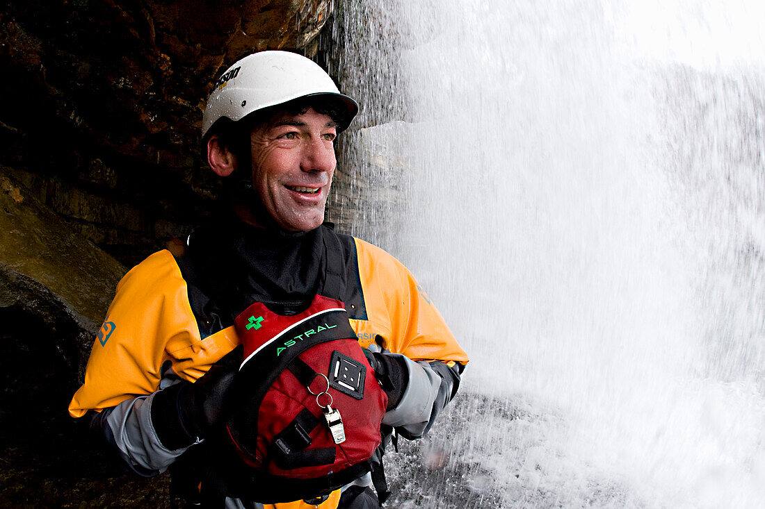 World Champion kayaker Eric Jackson underneath the waterfall at his hometown play spot in Rock Island, Tennessee.
