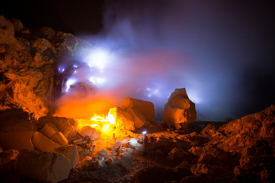 Sulfur miners start their night shift at the mine inside the crater of Kawah Ijen volcano, Banyuwangi, Java, Indonesia