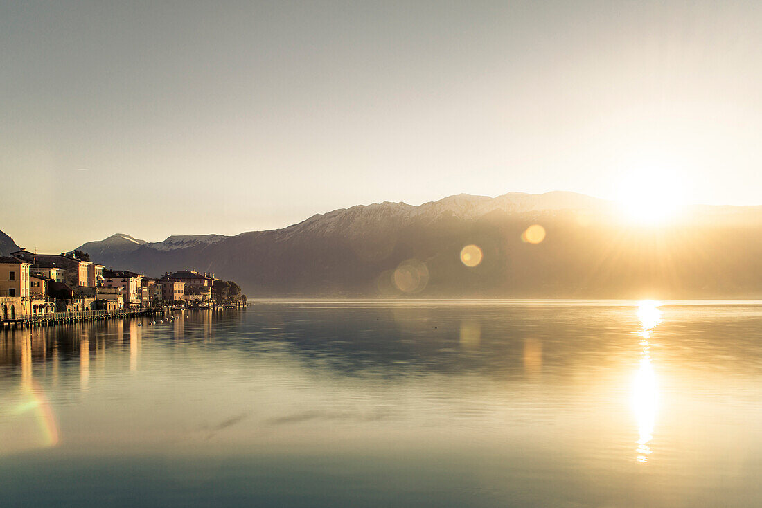 Seafront at Gargnano at sunrise, Lake Garda, Lombardy, Alps, Italy