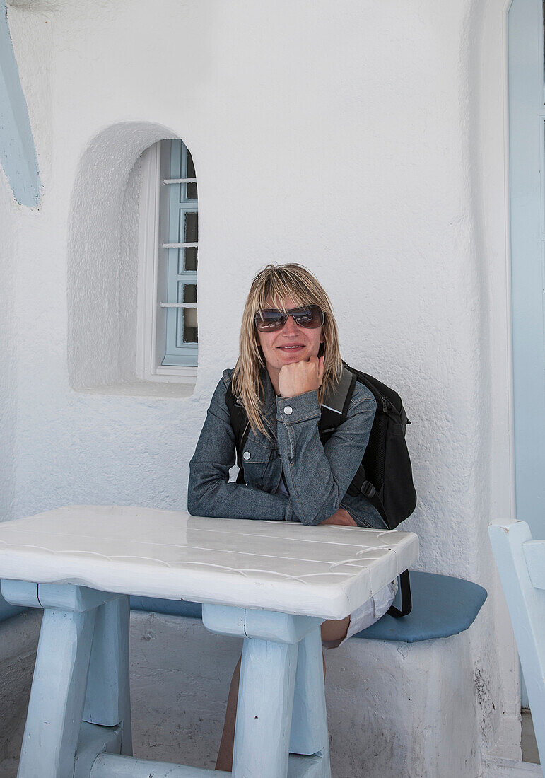 Caucasian woman sitting at table