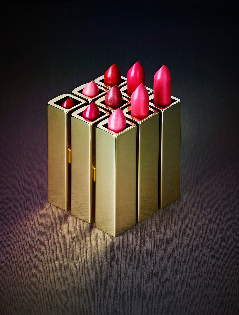 Close-up of various pink lipsticks on table