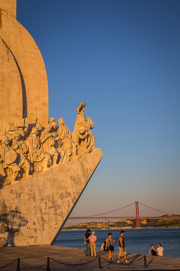 the monument to the discoveries built in 1960 on the occasion of the 500th anniversary of the death of henry the navigator, prince of portugal, and the 25th of april bridge, lisbon, portugal
