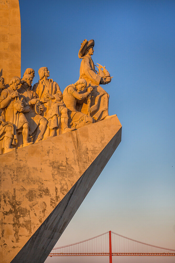 the monument to the discoveries built in 1960 on the occasion of the 500th anniversary of the death of henry the navigator, prince of portugal, and the 25th of april bridge, lisbon, portugal