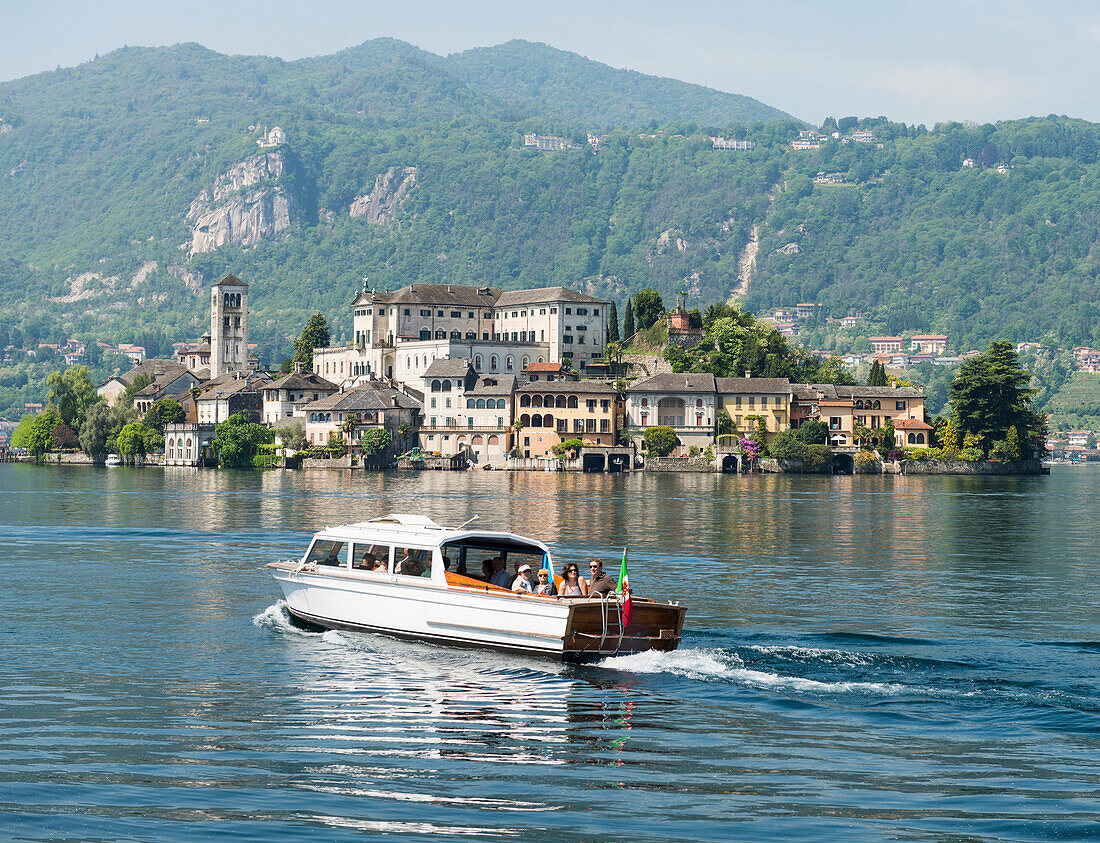 Passengers in a boat on Lake Orta Orta, Piedmont, Italy