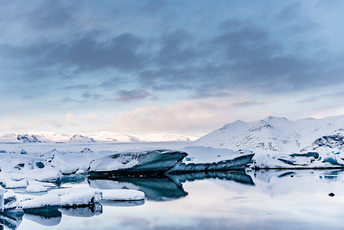 Joekulsarlon with growler at sunset, Glacierlagoon, Vatnajoekull Glacier in Winter, Iceland