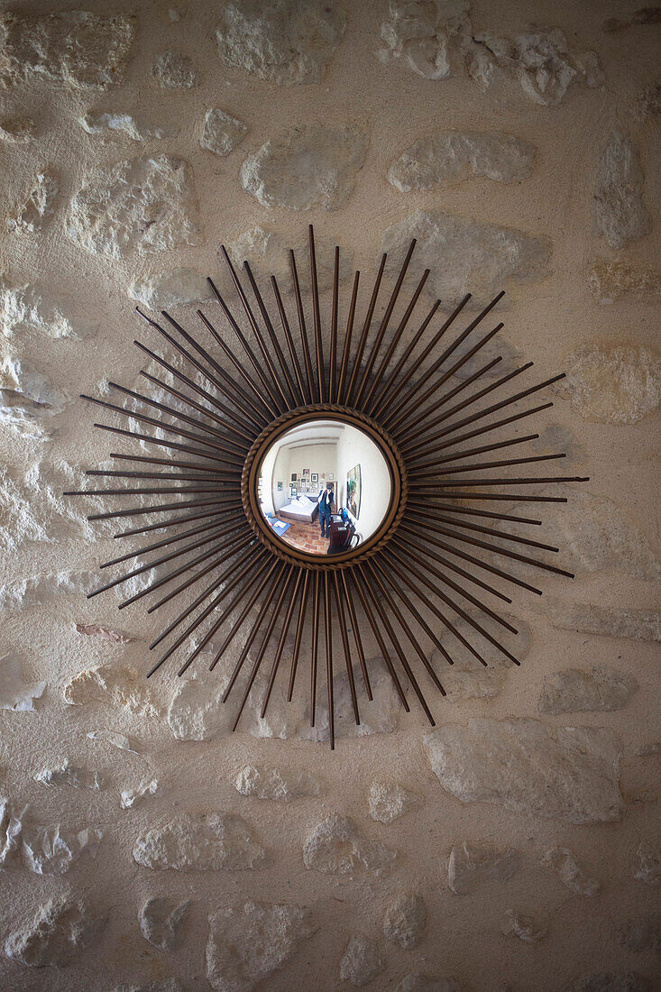 Decorative mirror mounted on wall