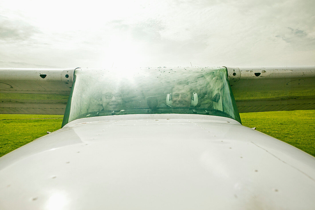 Father and son in private airplane