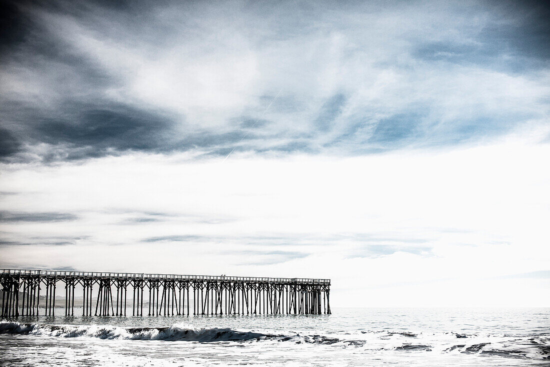 View of pier over sea against sky