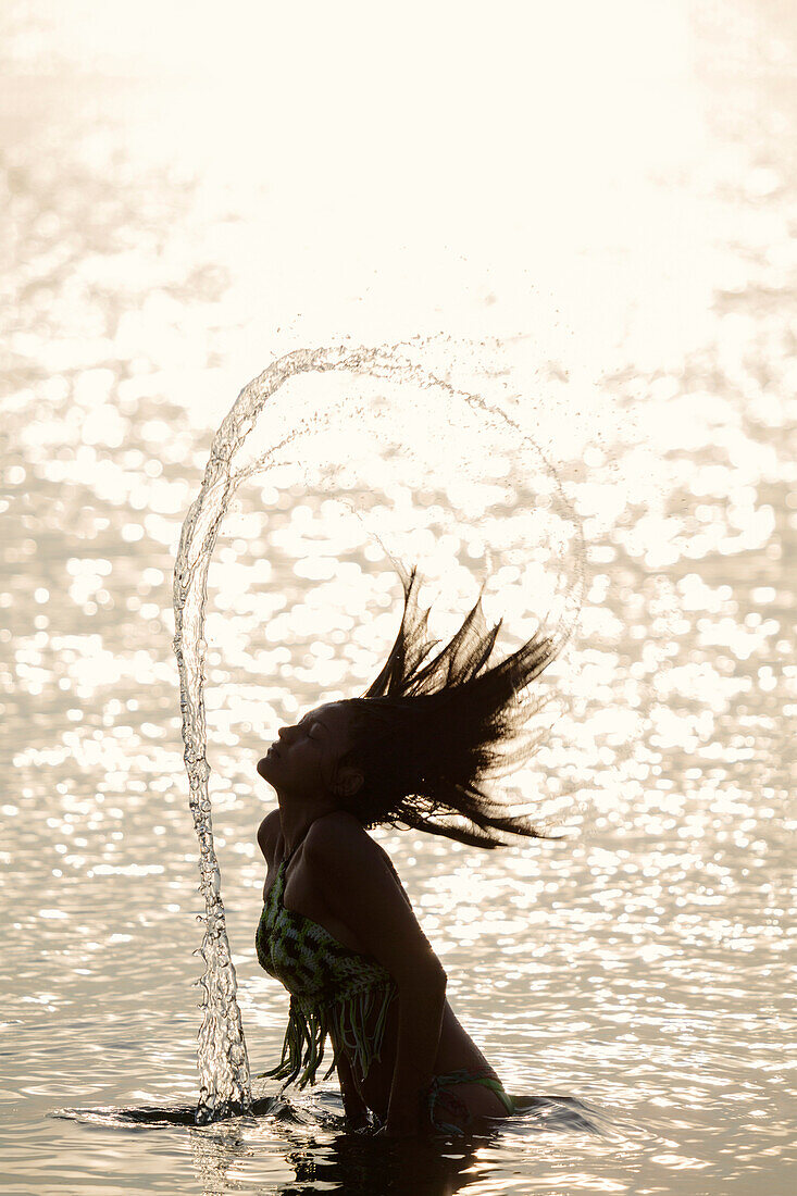A young Borari indigenous woman swimming in the Amazon, Alter do Chao, Para, Brazil, South America