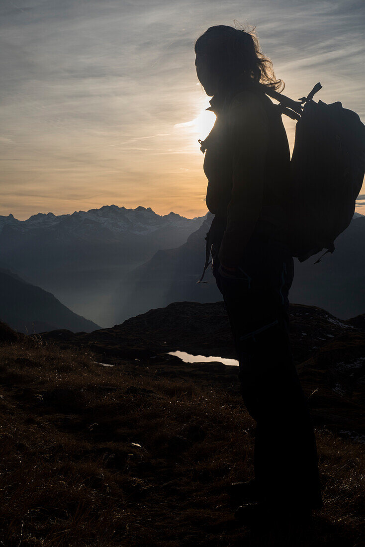 A hiker near Gufelstock, Glarus Alps, canton of Glarus, Switzerland