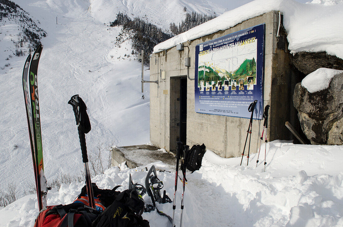 The so-called bunker and, in the background,  the pylon containing measuring devices after an artificially triggered massive avalanche has swept through the full-scale avalanche dynamics test site of the Swiss WSL Institute for Snow and Avalanche Research