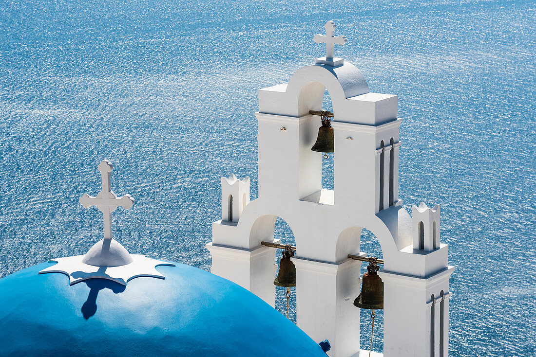 Bell tower and dome of the Greek orthodox Agios Theodori church with the Mediterranean Sea as a background, Firostefani, Santorin, Cyclades, Greece