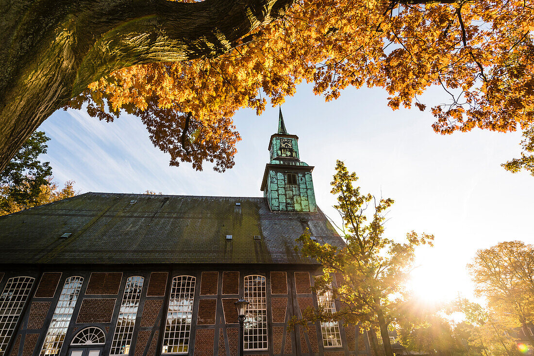 The Protestant-Lutheran Nienstedtener baroque church in autumn at sunset, Nienstedten, Hamburg, Germany