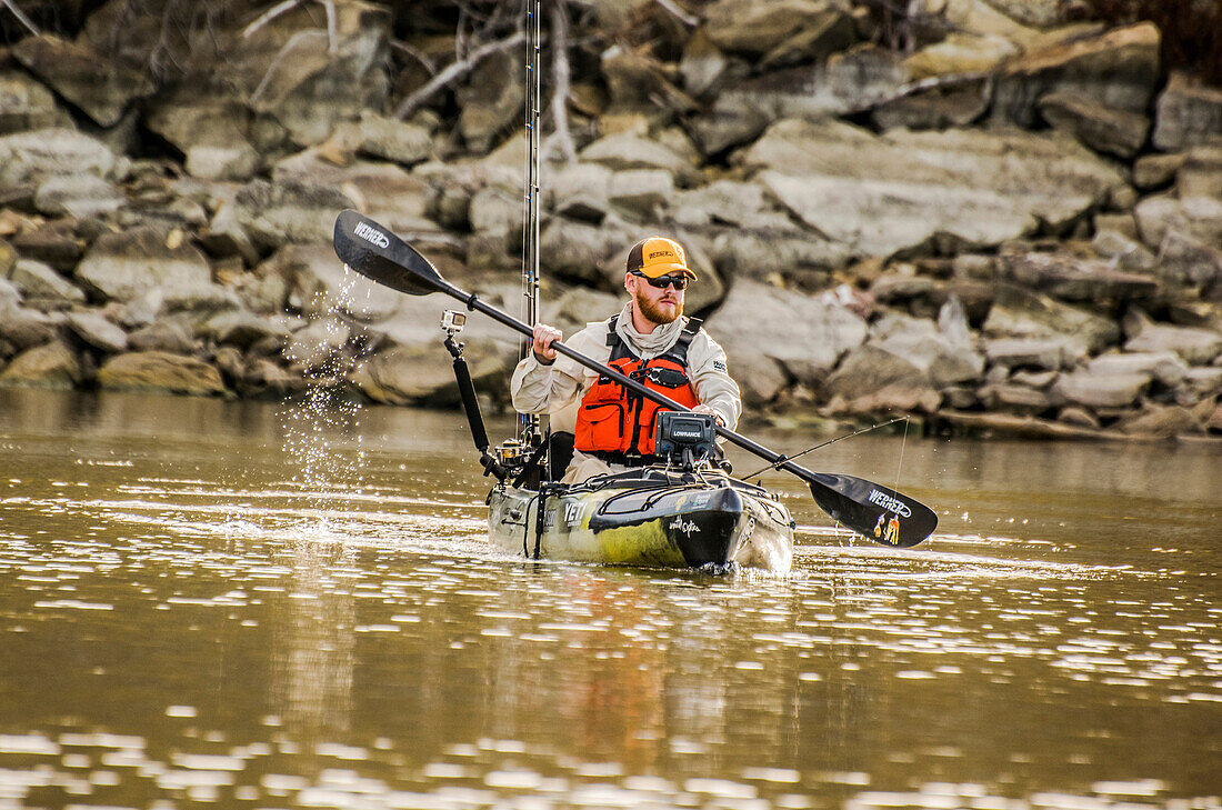 Kayak angler paddles in Mineral Wells TX in search of bass