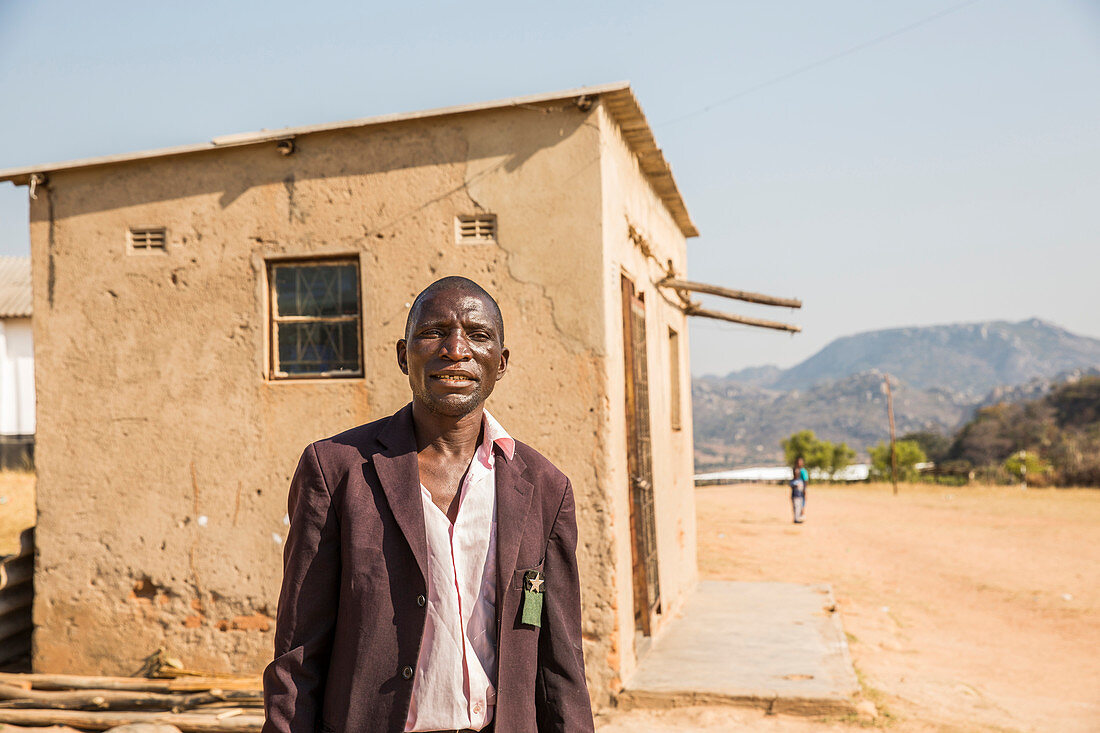 Zimbabwean man poses for a picture in his village