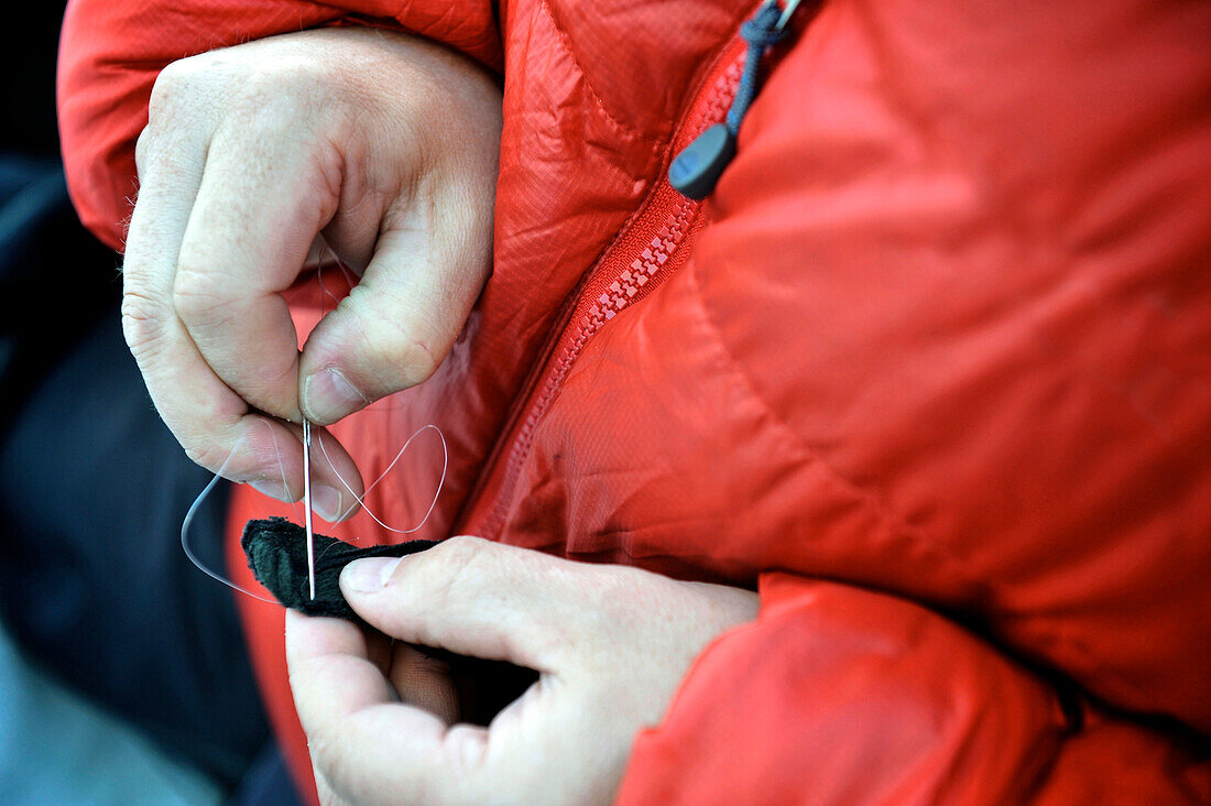 Equipment repairs help pass time as the team waits out weather at Camp One on the Sheep Glacier during a ski ascent of Mount Sanford in the Wrangell-St. Elias National Park outside of Glennallen, Alaska June 2011.  Mount Sanford at 16,237 feet is the sixt