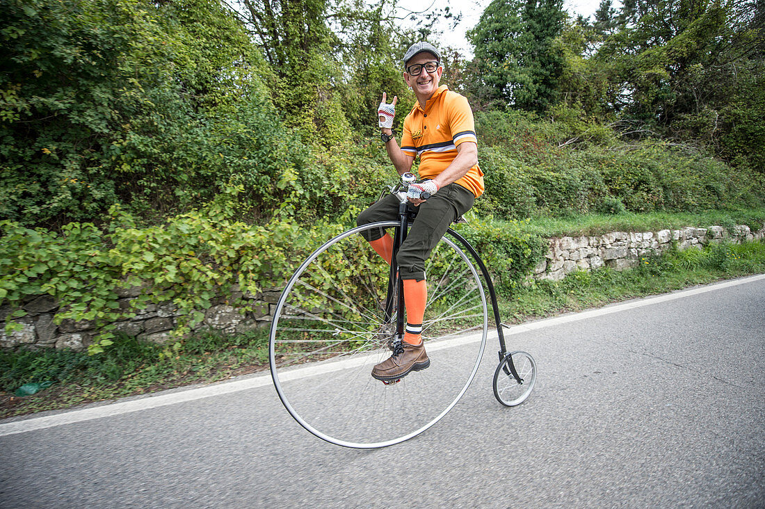 A velocipede, the ancestor of the bicycle, at the race. Eroica is a cycling event that takes place since 1997 in the province of Siena with routes that take place mostly on dirt roads with vintage bicycles. Usually it held on the first Sunday of October.