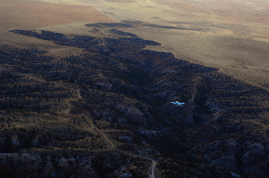Small aircraft over Palo Duro Canyon from the air.