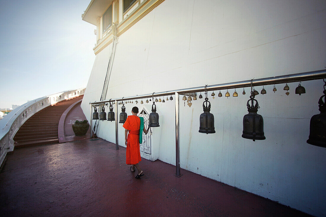 Monks are going up the stairs to reach the temple. Thailand Bangkok