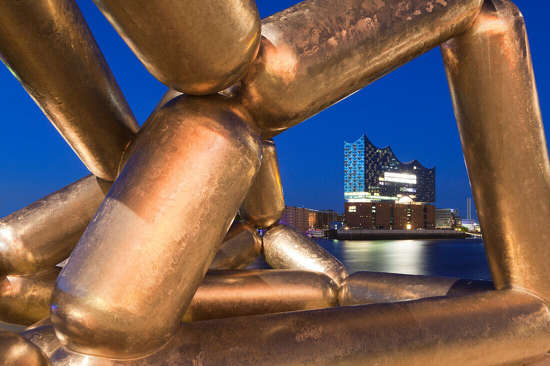 Sculpture by Richard Deacon in front of the Stage Theatre, view over the Elbe river to the Elbphilharmonie, Hamburg, Germany