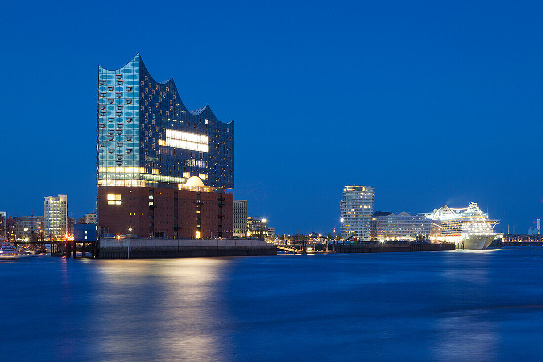 View over the Elbe river to the Elbphilharmonie, cruise liner at Hamburg Cruise Center, Hamburg, Germany