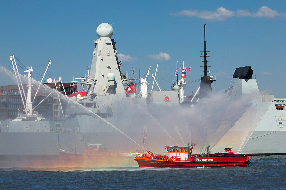 Fire brigade in front of a naval vessel at the harbour, Hamburg, Germany