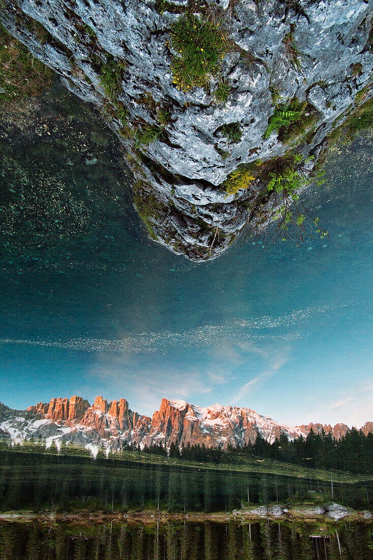 Lake Karersee reflecting the Rosengarten mountain range, Dolomites, Unesco world heritage, South Tyrol, Italy