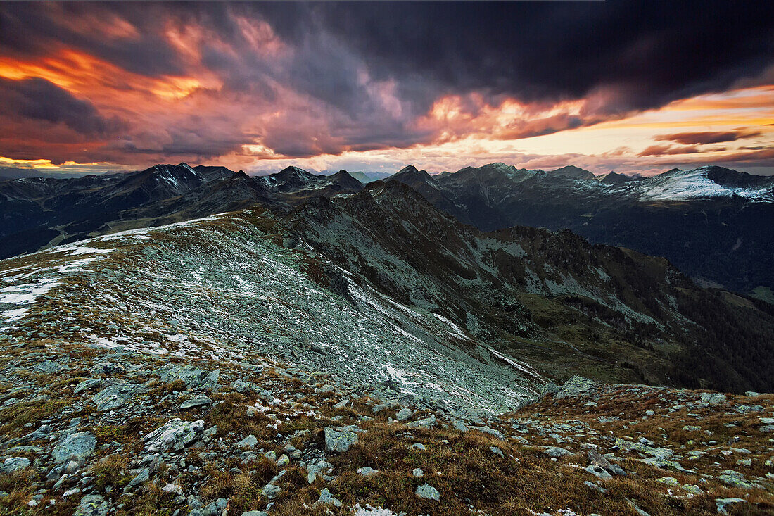 View from Koenigsangerspitze at sunset in the direction of Sarntal valley, South Tyrol, Italy