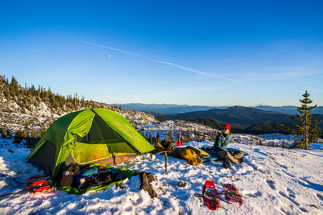 Campers and their tent on Mt. St. Helens in the winter.