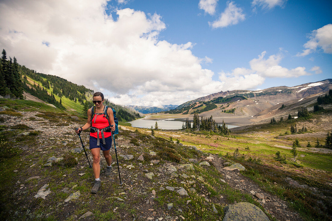 A young woman hiking near Helm Lake in Garibaldi Provincial Park, British Columbia, Canada.