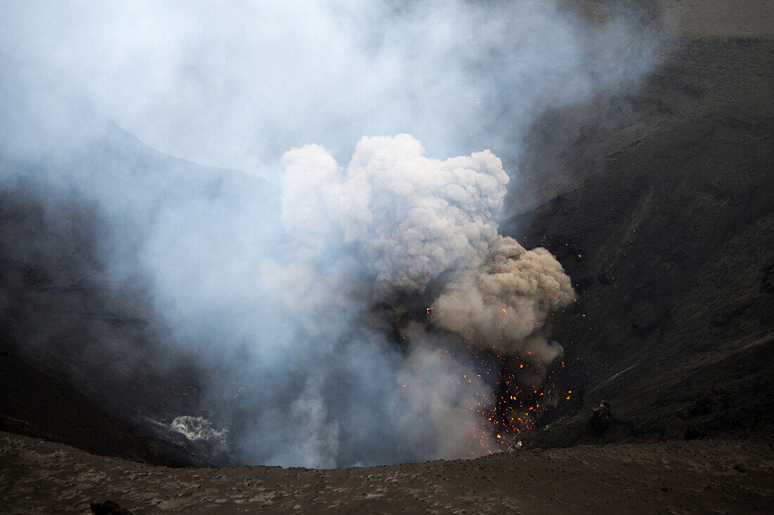 On the rim of the crater of the active volcano Yasur on the island of Tanna