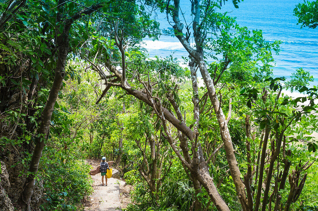 Surfer on the road to surfspot, Bali, Indonesia.