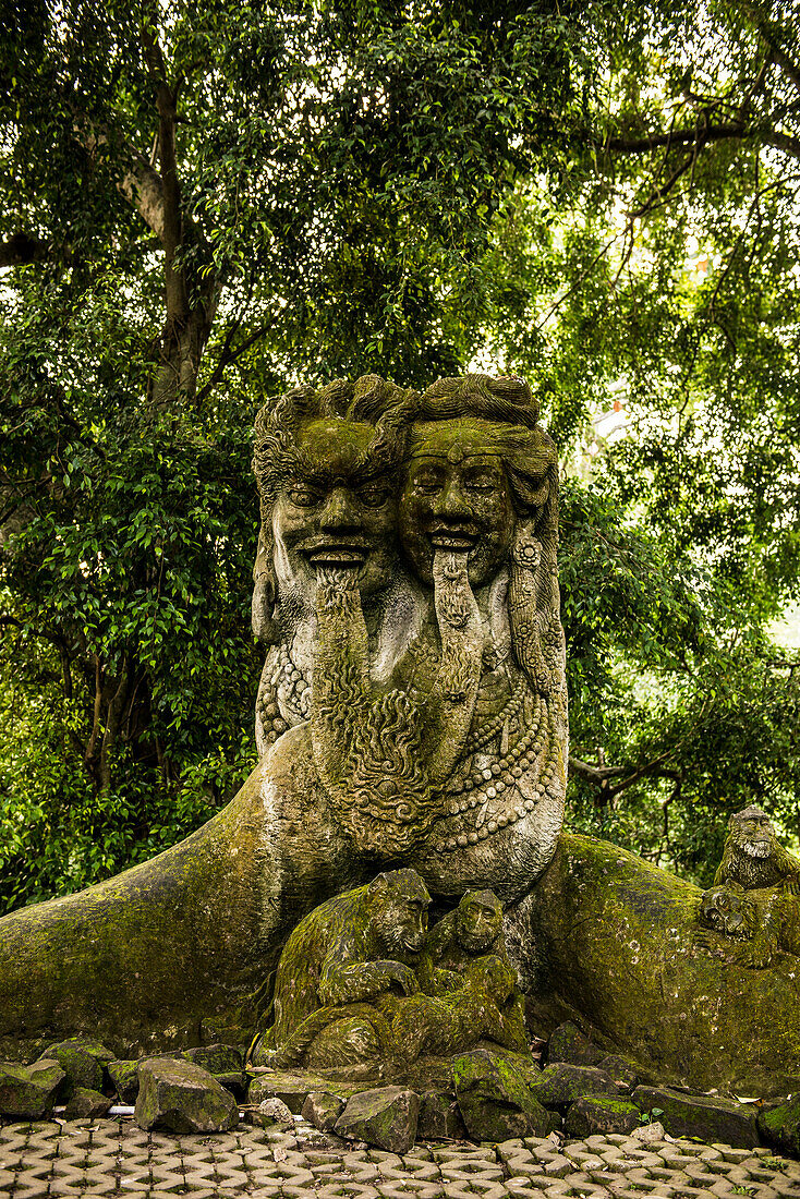 Balinese stone temple figures heads in the city of Temple Ubut, Bali, Indonesia