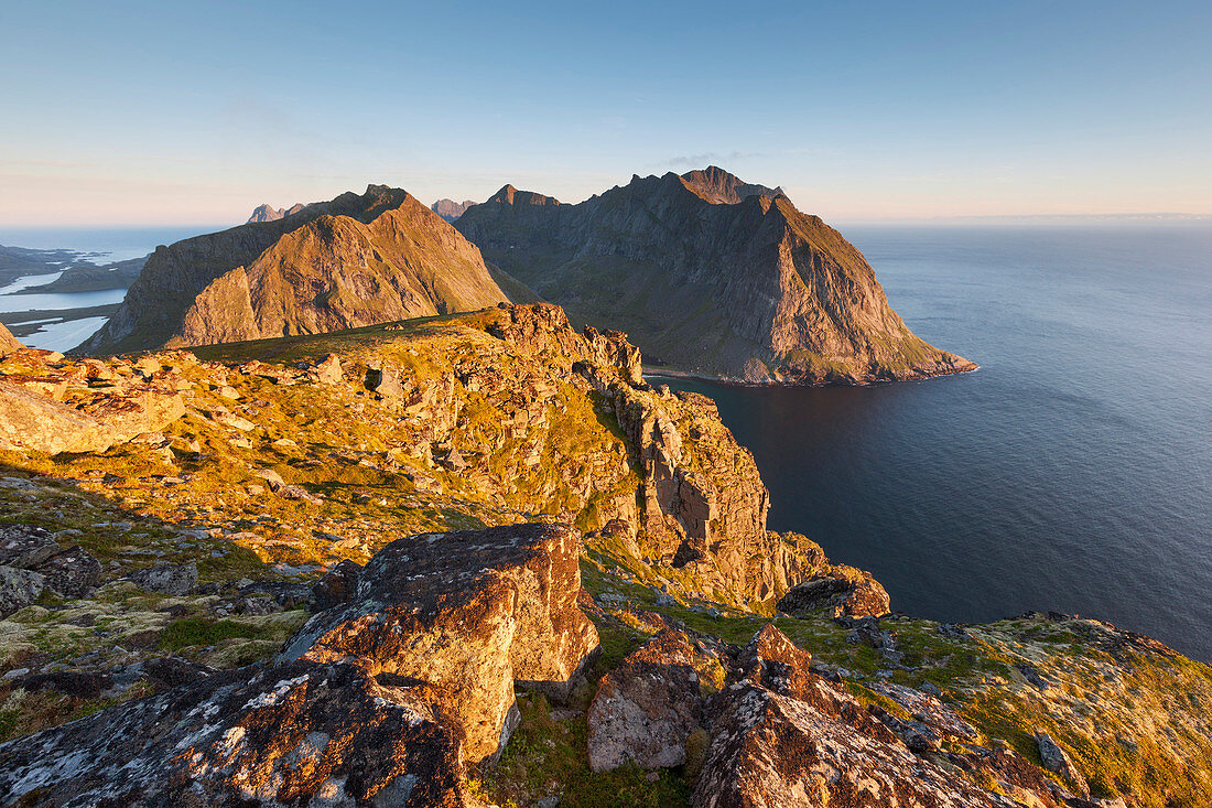 Wide view from top of Ryten to the surrounding mountains in the last evening light, Moskenesøy, Lofoten, Norway, Scandinavia