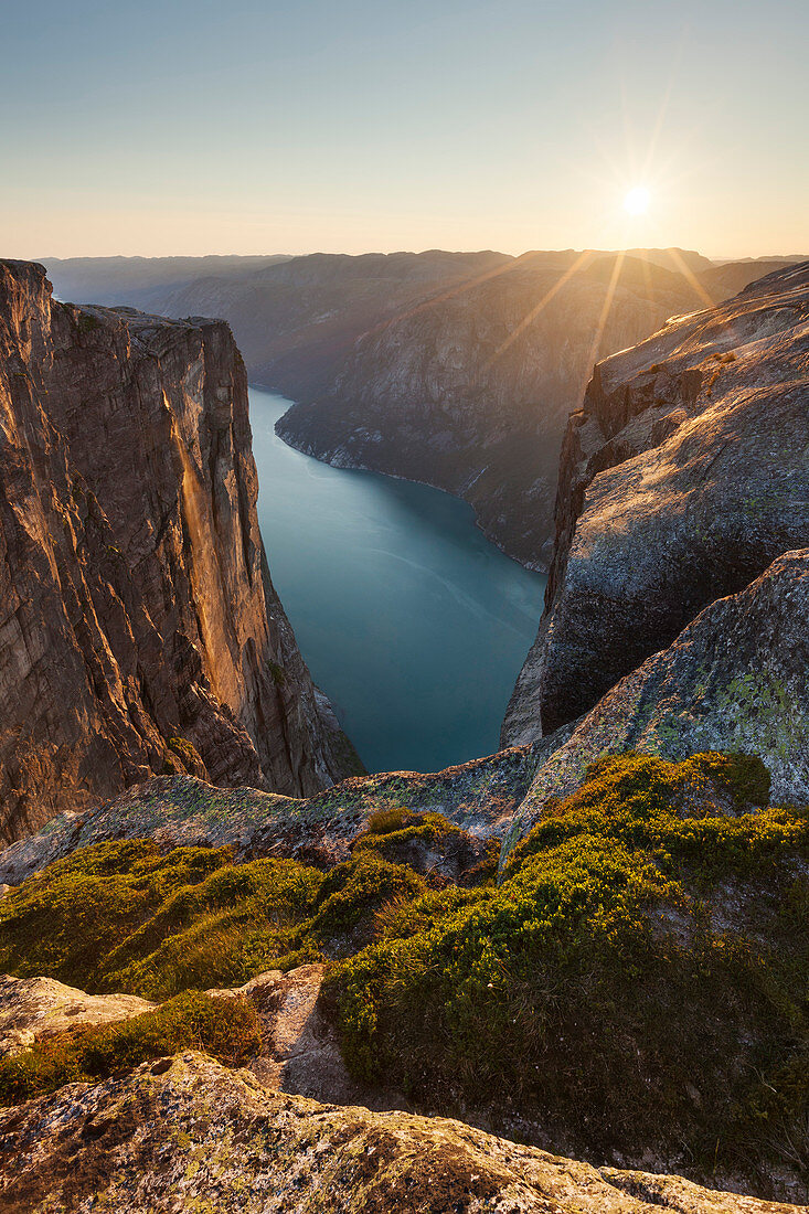 Overlooking the Lysefjord from Kjerag plateau of rocks in the setting sun, Rogaland, Norway, Scandinavia