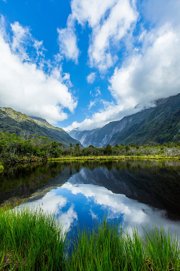 Mountains reflecting in remote lake