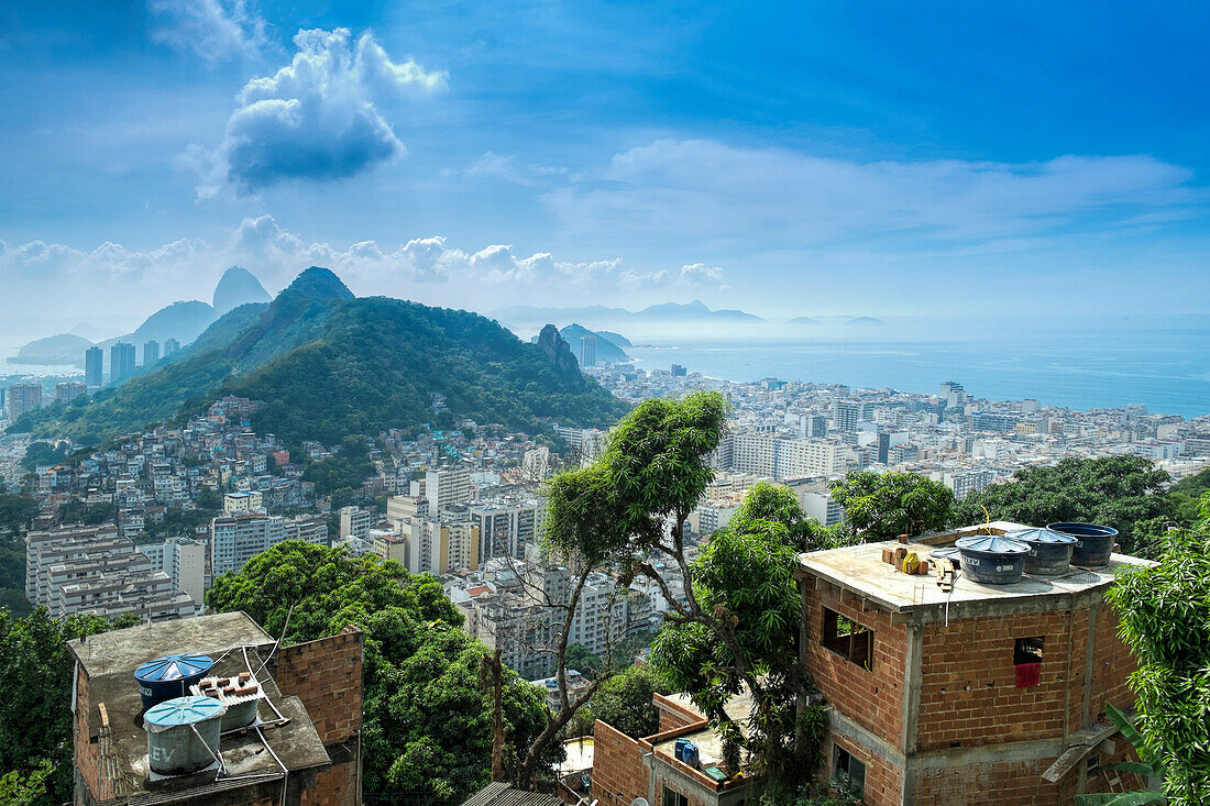Rio de Janeiro from Cabritos favela in Copacabana, Moro Sao Joao and Sugar Loaf in the foreground, Copacabana right of frame, Rio de Janeiro, Brazil, South America
